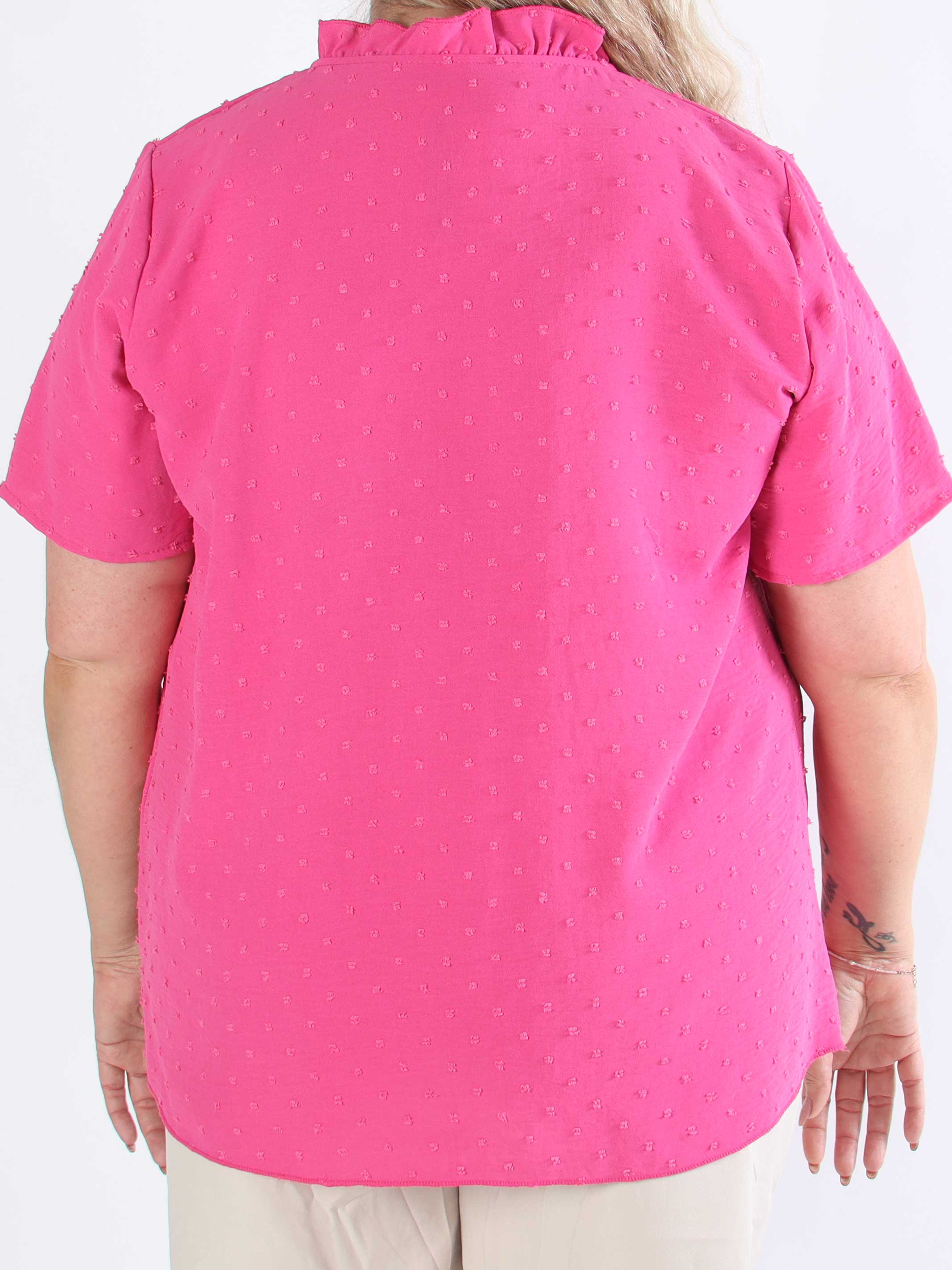 Bloom - Söt tunika i plusstorlek med volangkant och rosett